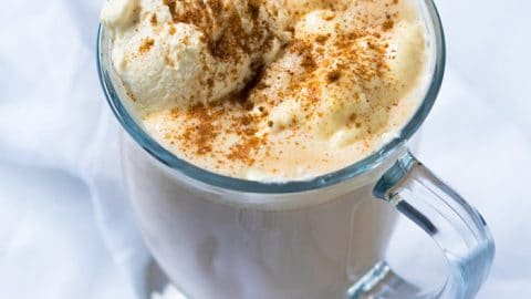 Paleo & keto pumpkin spice latte in a glass mug with whipped cream