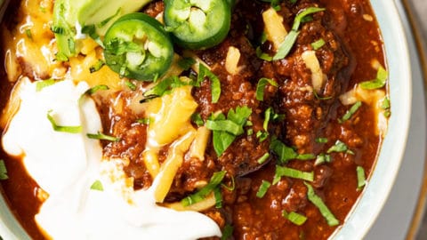 Bowl of keto chili with with toppings