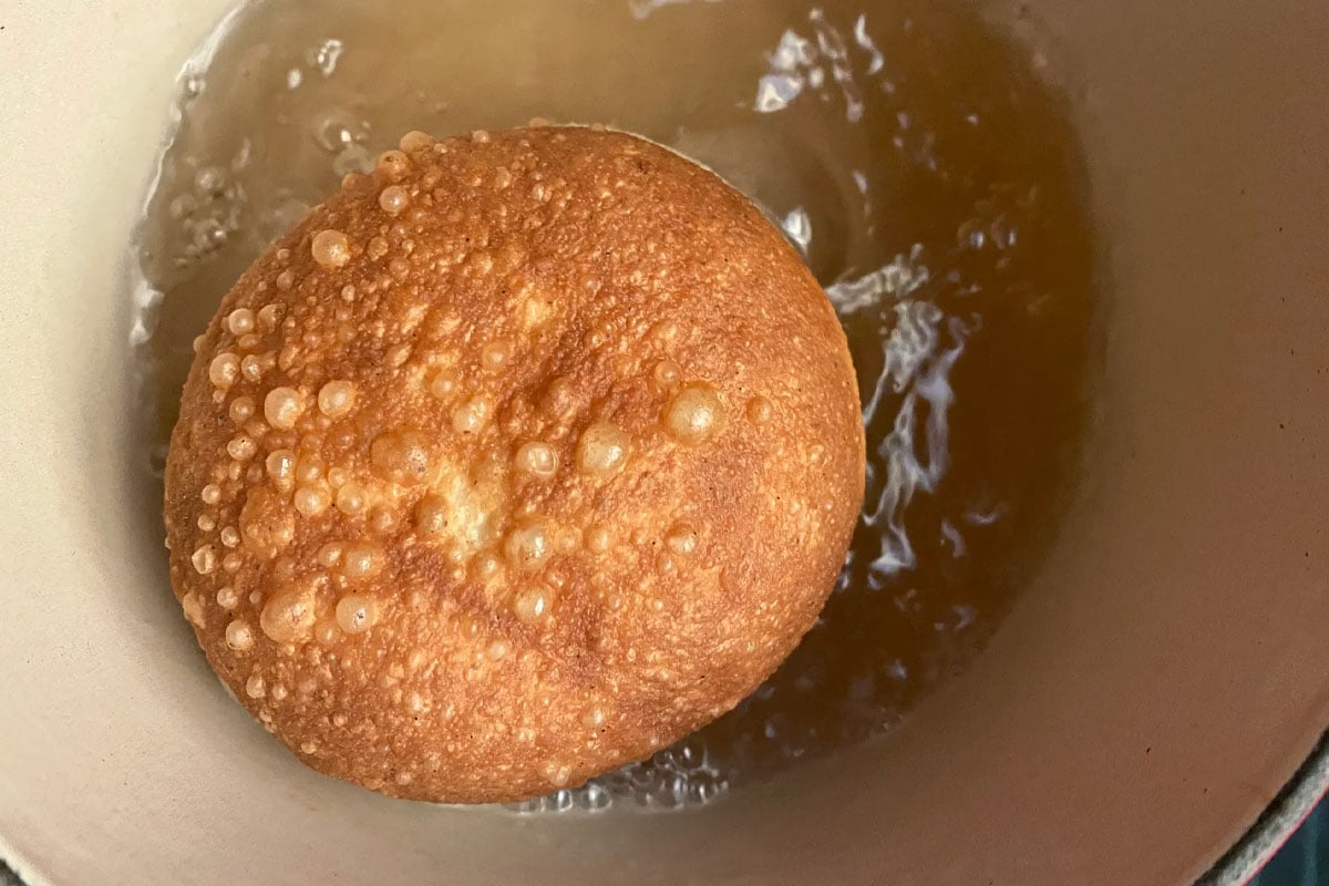 Frying a sourdough donut in beef tallow