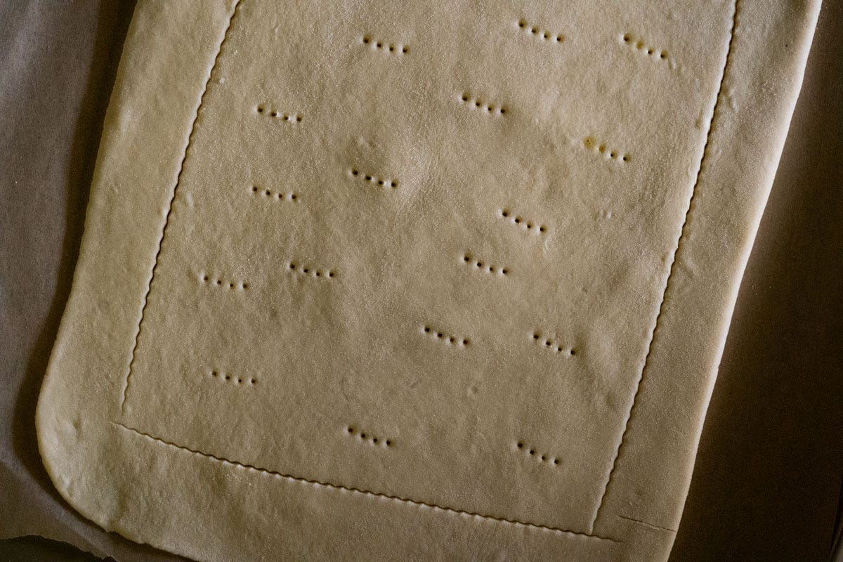 Rolling out a sourdough rough puff pastry